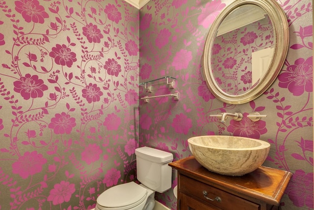 2112 W 11th St, Austin, TX 78703 - bathroom with wallpapered walls, toilet, and vanity