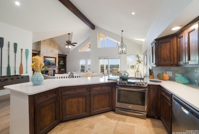 693 Riviera Dr, Canyon Lake, TX 78133 - kitchen featuring stainless steel appliances, open floor plan, light countertops, a ceiling fan, and beamed ceiling
