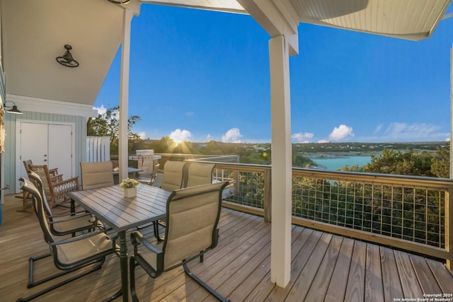 693 Riviera Dr, Canyon Lake, TX 78133 - wooden deck with a water view and outdoor dining space