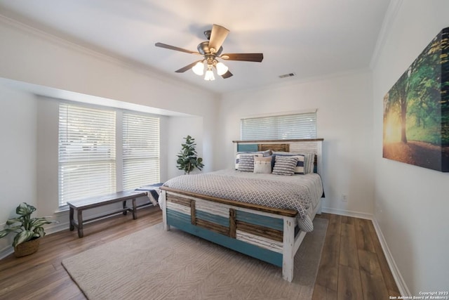 693 Riviera Dr, Canyon Lake, TX 78133 - bedroom featuring ornamental molding, wood finished floors, baseboards, and a ceiling fan