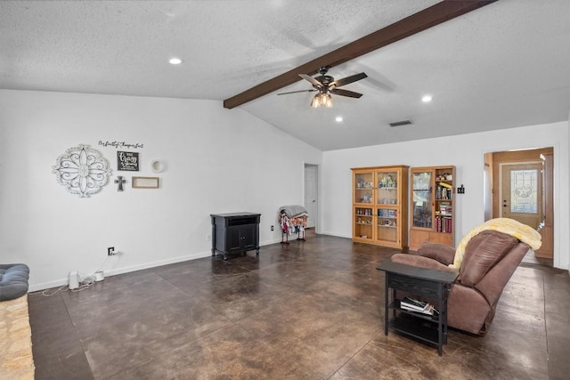 living area with a ceiling fan, a textured ceiling, a wood stove, recessed lighting, and baseboards