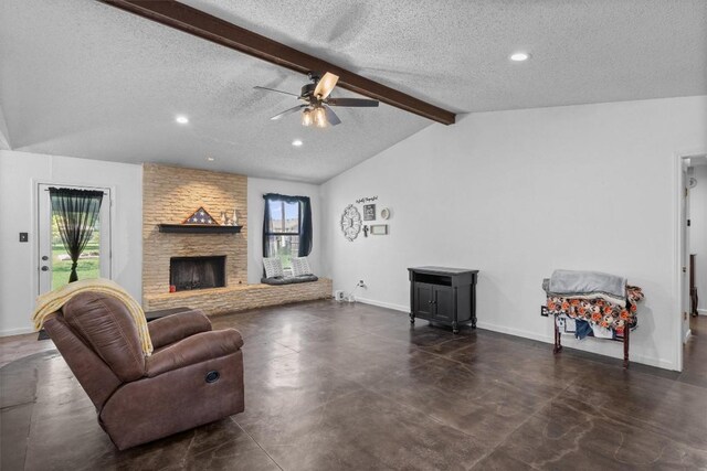 living room featuring a textured ceiling, healthy amount of natural light, a ceiling fan, concrete flooring, and baseboards