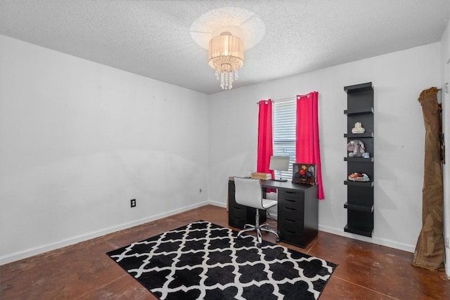 office area with a textured ceiling, finished concrete floors, baseboards, and a chandelier