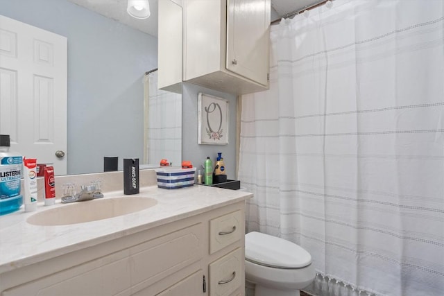full bathroom featuring toilet and vanity