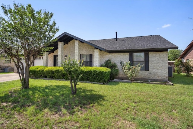 view of front facade featuring a front lawn, brick siding, central AC, and roof with shingles
