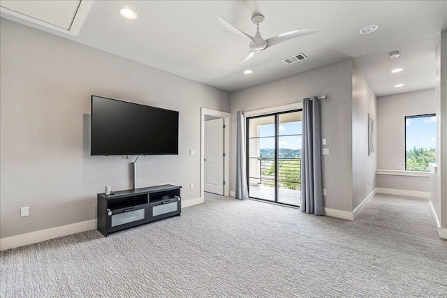 27 Wingreen Loop, The Hills, TX 78738 - unfurnished living room with carpet, a ceiling fan, and recessed lighting