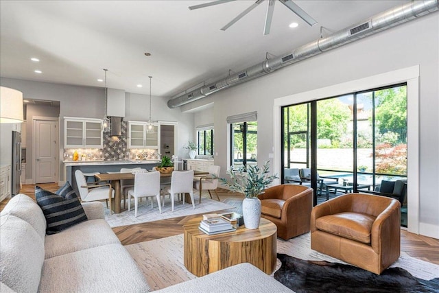27 Wingreen Loop, The Hills, TX 78738 - living room featuring a ceiling fan, plenty of natural light, and recessed lighting
