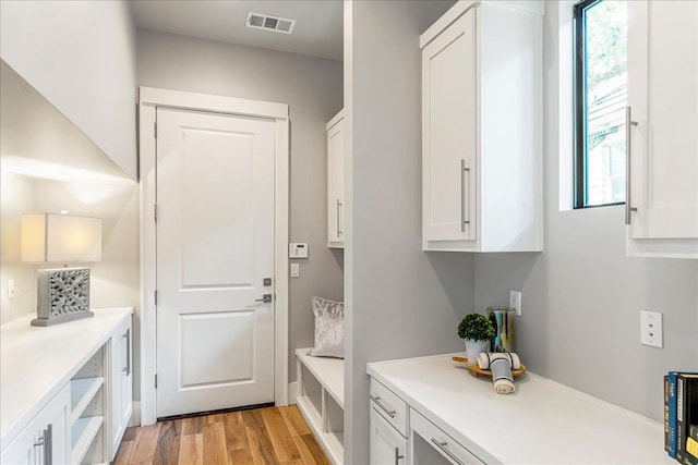 27 Wingreen Loop, The Hills, TX 78738 - mudroom with plenty of natural light and light wood finished floors