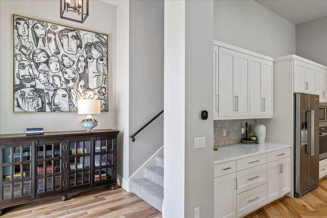 27 Wingreen Loop, The Hills, TX 78738 - stairs with wood finished floors