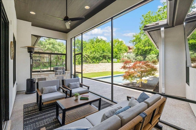 27 Wingreen Loop, The Hills, TX 78738 - sunroom / solarium with an outdoor kitchen, an outdoor hangout area, and a ceiling fan