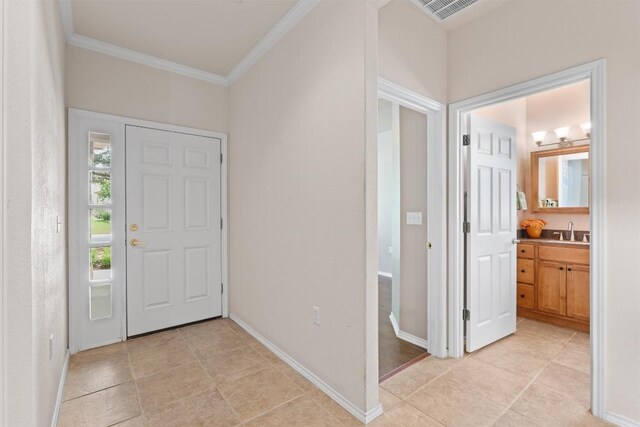 233 Crockett Loop, Georgetown, TX 78633 - entryway featuring ornamental molding, light tile patterned floors, and baseboards