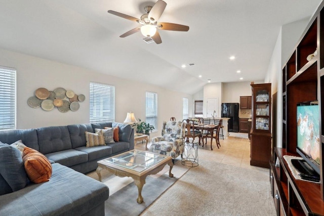 6032 Urbano Bnd, Round Rock, TX 78665 - living room with lofted ceiling, ceiling fan, light tile patterned flooring, light carpet, and recessed lighting