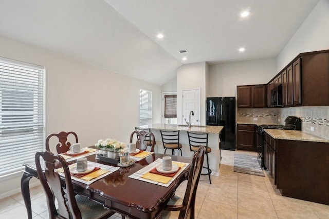 6032 Urbano Bnd, Round Rock, TX 78665 - dining room with light tile patterned floors, lofted ceiling, and recessed lighting