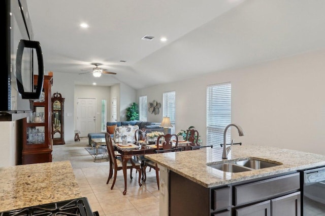 6032 Urbano Bnd, Round Rock, TX 78665 - kitchen with dishwasher, ceiling fan, light stone countertops, open floor plan, and light tile patterned floors