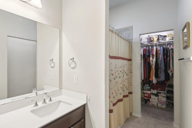 6032 Urbano Bnd, Round Rock, TX 78665 - full bath featuring vanity, tile patterned flooring, a walk in closet, and curtained shower