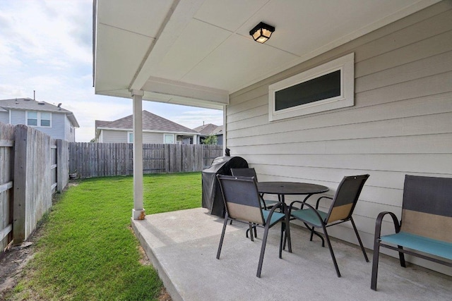 6032 Urbano Bnd, Round Rock, TX 78665 - fenced backyard with a patio, a grill, and outdoor dining space