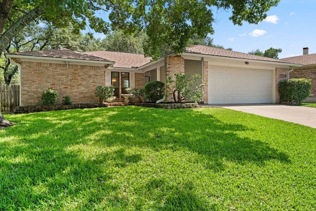 view of front of house with brick siding, an attached garage, and concrete driveway