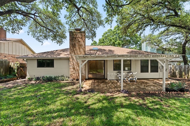 rear view of house featuring a patio, a chimney, and a pergola