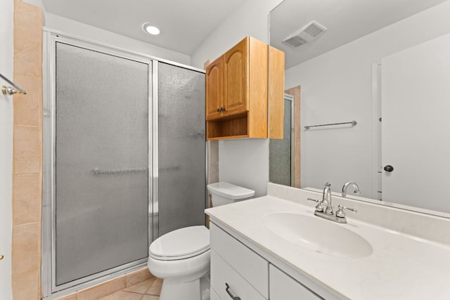 full bathroom featuring a stall shower, toilet, tile patterned flooring, and vanity