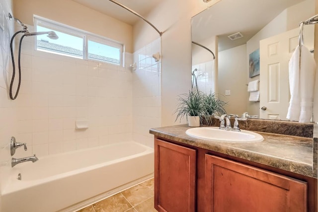 bathroom with  shower combination, vanity, and tile patterned flooring