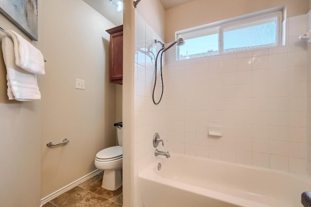 bathroom featuring toilet, shower / tub combination, baseboards, and tile patterned floors
