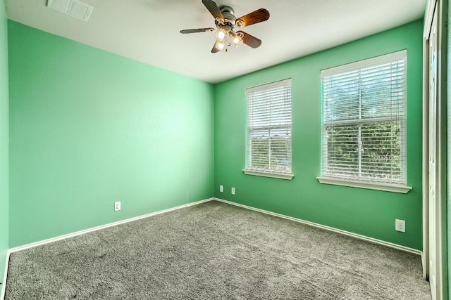 815 Craters Of The Moon Blvd, Pflugerville, TX 78660 - spare room with carpet, a ceiling fan, and baseboards