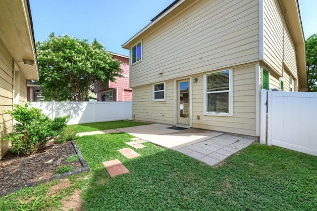 rear view of property featuring a patio area