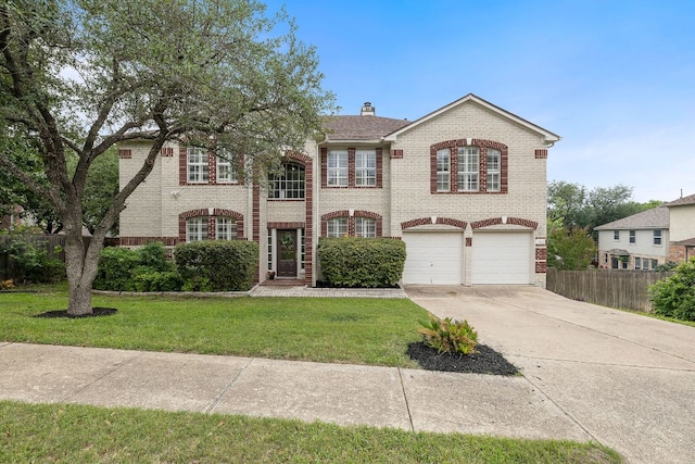 3805 Durnberry Ln, Round Rock, TX 78664 - view of front of house featuring brick siding, driveway, a garage, and a chimney