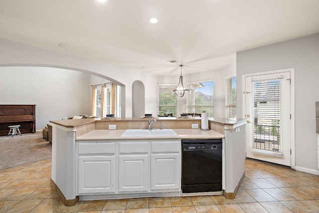 3805 Durnberry Ln, Round Rock, TX 78664 - kitchen with dishwasher, arched walkways, white cabinets, light countertops, and recessed lighting