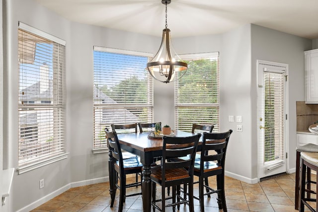 3805 Durnberry Ln, Round Rock, TX 78664 - dining area featuring light tile patterned floors and a chandelier