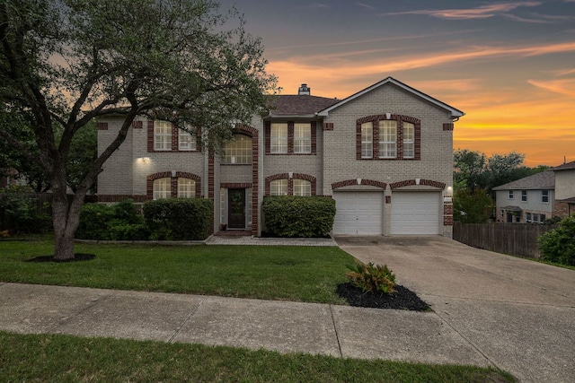 3805 Durnberry Ln, Round Rock, TX 78664 - view of front of home with brick siding, concrete driveway, a chimney, and a garage