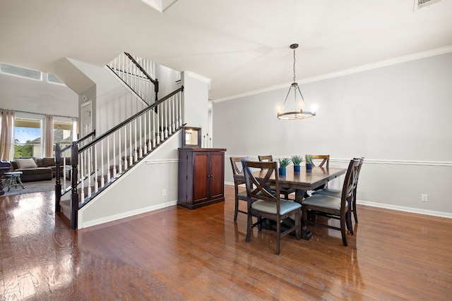3805 Durnberry Ln, Round Rock, TX 78664 - dining space featuring wood finished floors, crown molding, stairway, and a chandelier