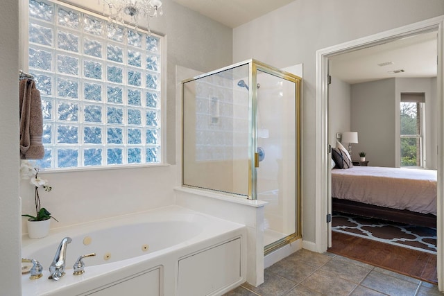 3805 Durnberry Ln, Round Rock, TX 78664 - ensuite bathroom with a stall shower, a tub with jets, and healthy amount of natural light