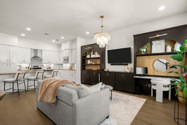 2520 Bluebonnet Ln Unit 32, Austin, TX 78704 - living room featuring a chandelier, wood finished floors, and recessed lighting