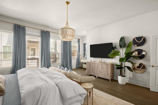 2520 Bluebonnet Ln Unit 32, Austin, TX 78704 - bedroom featuring a chandelier, wood finished floors, and multiple windows
