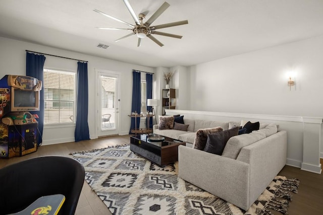 2520 Bluebonnet Ln Unit 32, Austin, TX 78704 - living room featuring a ceiling fan, baseboards, and wood finished floors
