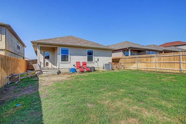 12224 Token Trl, Elgin, TX 78621 - back of property featuring cooling unit and roof with shingles