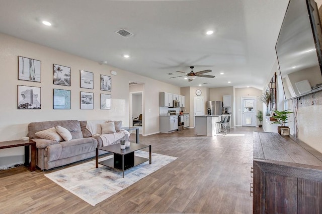 12224 Token Trl, Elgin, TX 78621 - living room with ceiling fan, light wood finished floors, recessed lighting, and baseboards