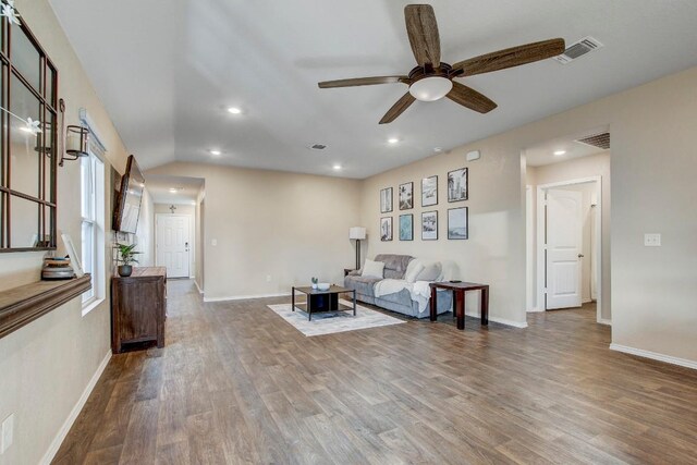 12224 Token Trl, Elgin, TX 78621 - living area with ceiling fan, wood finished floors, baseboards, recessed lighting, and vaulted ceiling