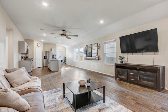 12224 Token Trl, Elgin, TX 78621 - living area with ceiling fan, wood finished floors, recessed lighting, and baseboards