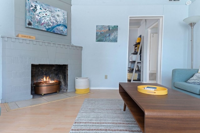 4611 Rosedale Ave, Austin, TX 78756 - living room with wood finished floors and a fireplace with flush hearth