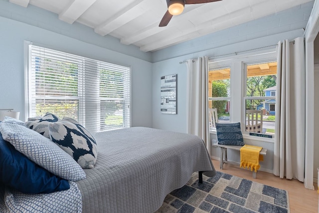 4611 Rosedale Ave, Austin, TX 78756 - bedroom featuring beam ceiling, multiple windows, wood finished floors, and ceiling fan