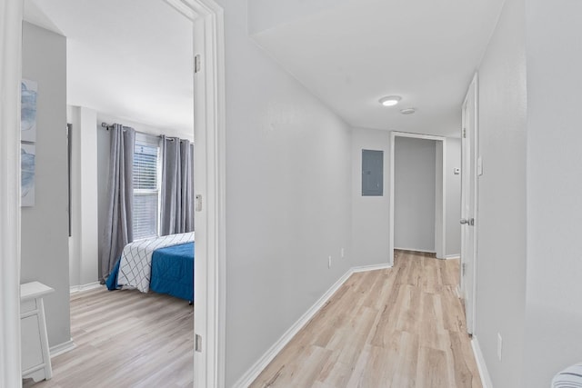 4611 Rosedale Ave, Austin, TX 78756 - hallway featuring light wood finished floors, electric panel, and baseboards