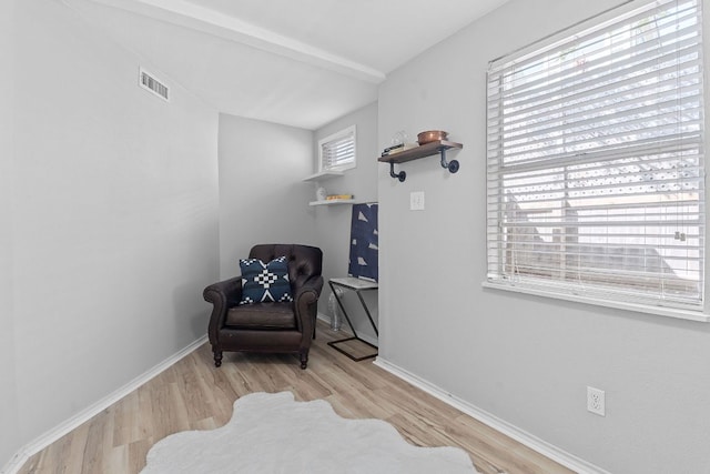 4611 Rosedale Ave, Austin, TX 78756 - sitting room with wood finished floors, baseboards, and beam ceiling