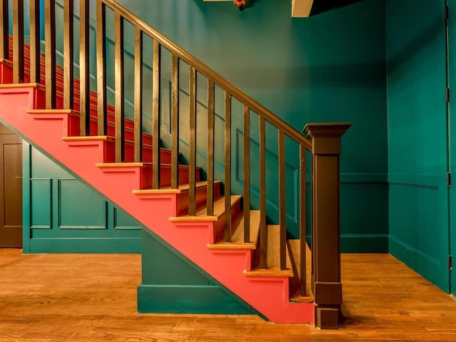 stairway featuring wood finished floors