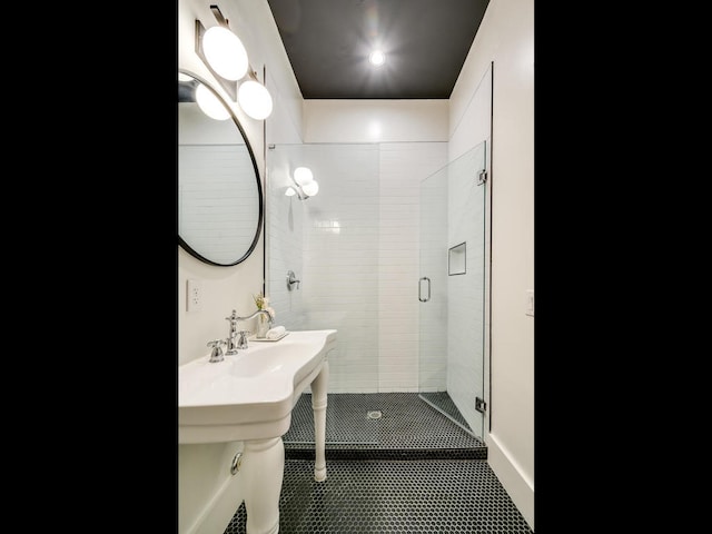 full bath featuring a stall shower and tile patterned flooring