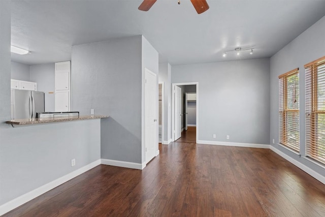 2414 Longview St Unit 303, Austin, TX 78705 - unfurnished room featuring a ceiling fan and dark wood finished floors