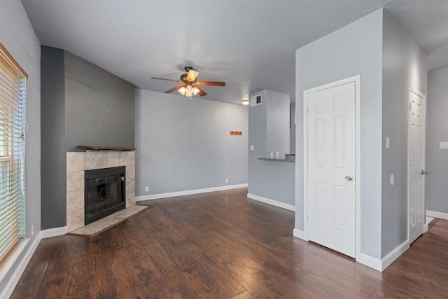 2414 Longview St Unit 303, Austin, TX 78705 - unfurnished living room with a ceiling fan, wood finished floors, a fireplace, and plenty of natural light