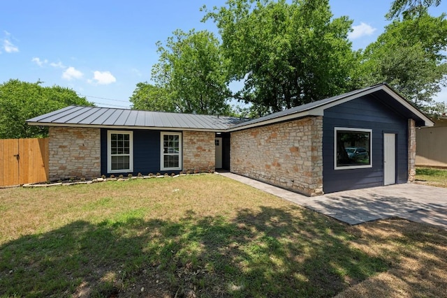 7002 Teaberry Dr, Austin, TX 78745 - view of front of house with stone siding, a metal roof, and a standing seam roof