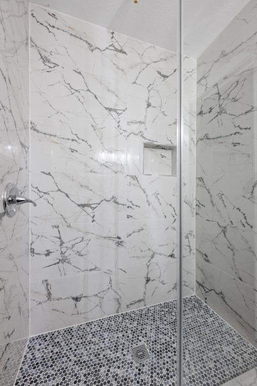 7002 Teaberry Dr, Austin, TX 78745 - full bath with a marble finish shower